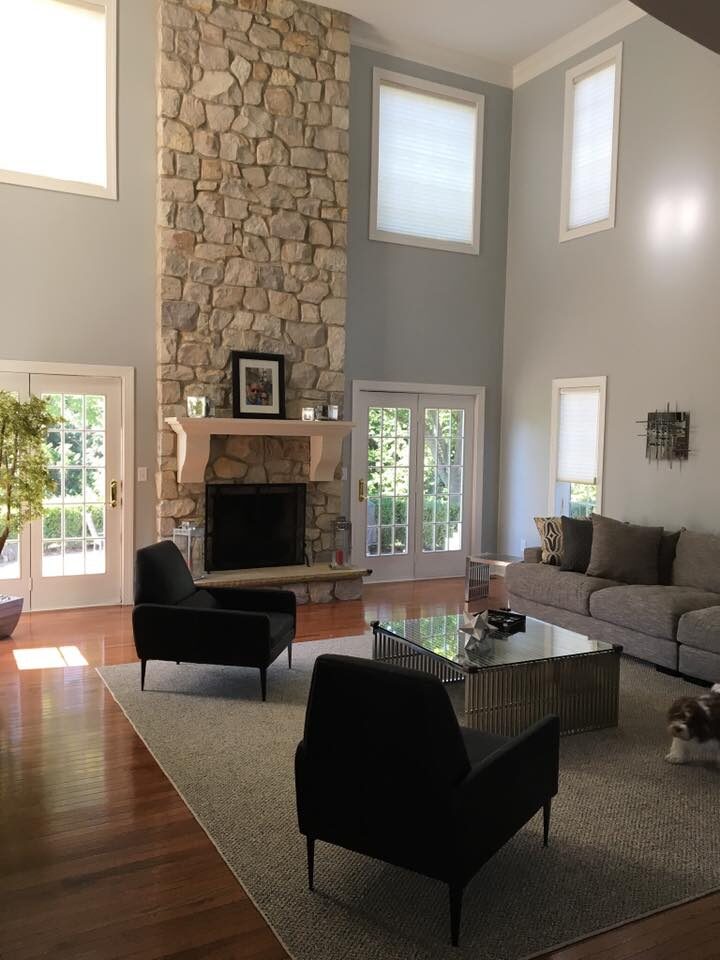 Two storey great room with grey walls and white trim painted in a Bridgewater home